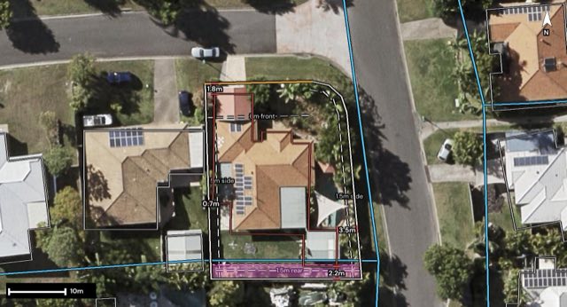 Aerial of 2 Ninigo Street, Pacific Pines QLD 4211 with the block outlined