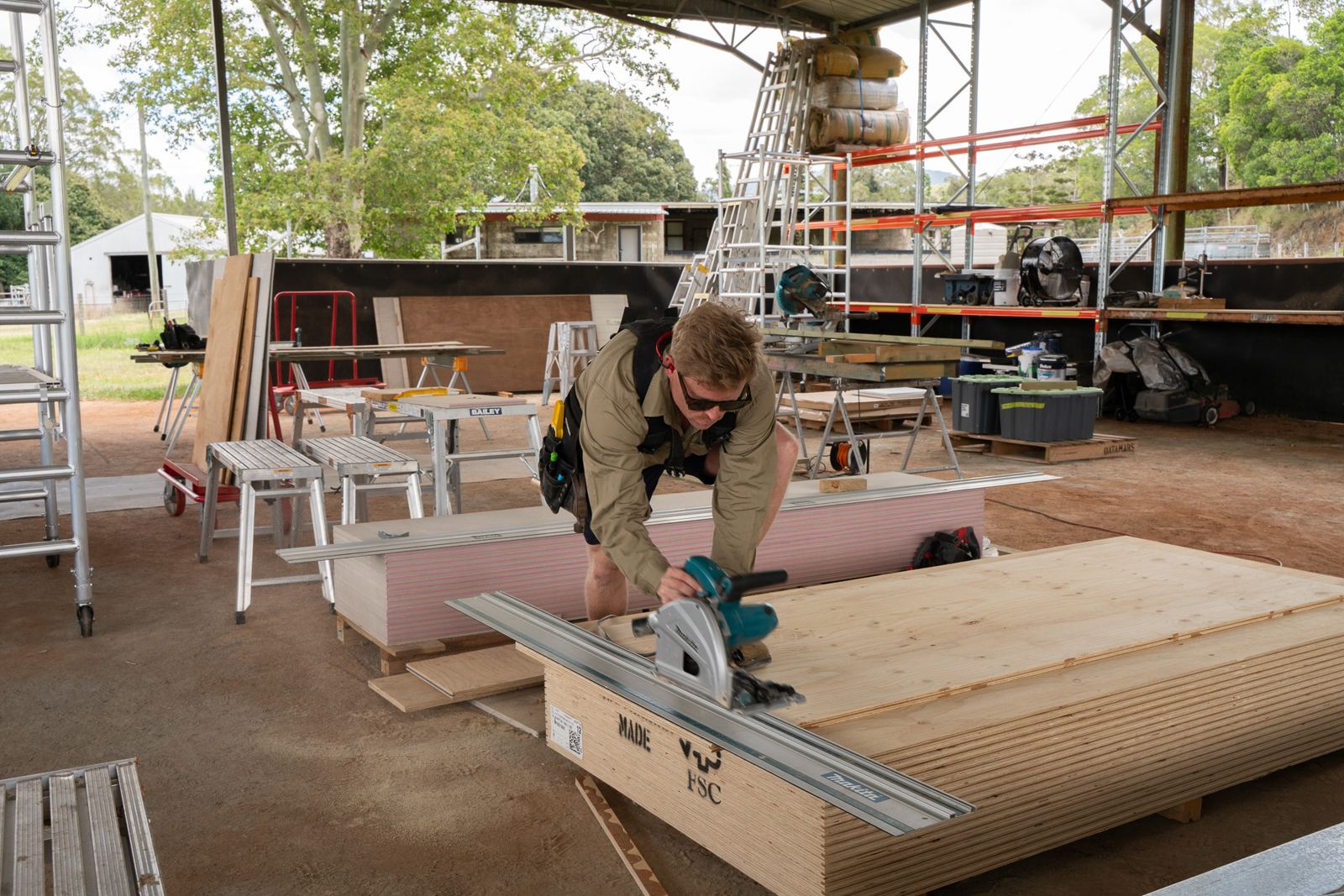 Builder cutting with a track saw